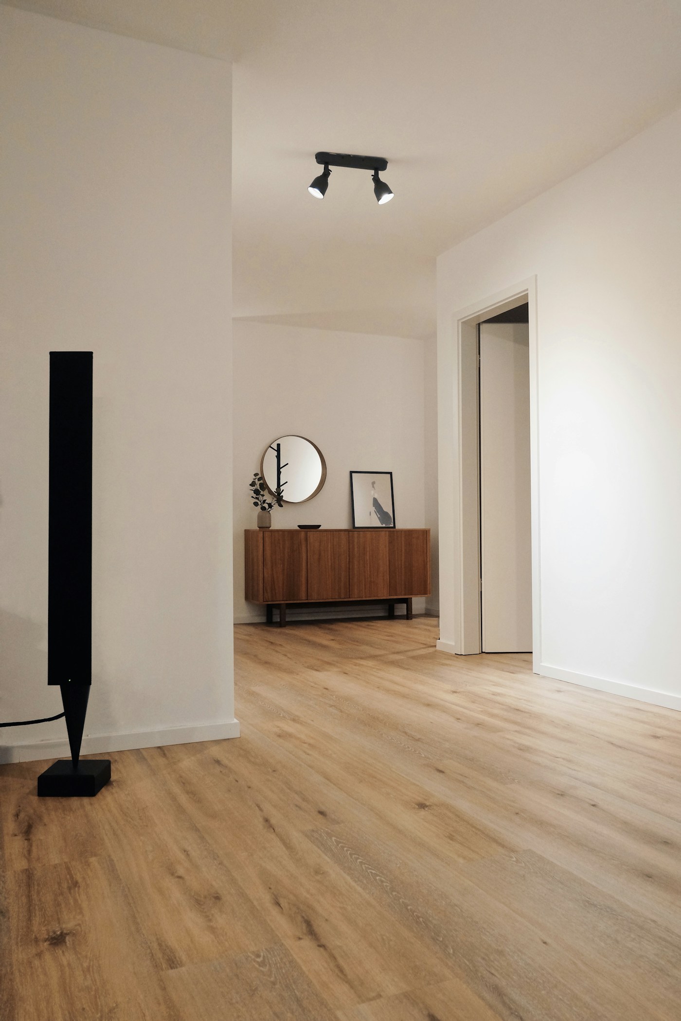 Representative interior with a wood-look plank floor; exact flooring material unverified